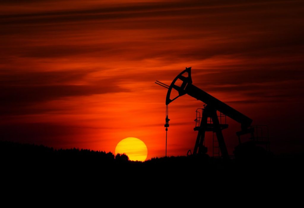 Oil derrick at sunset