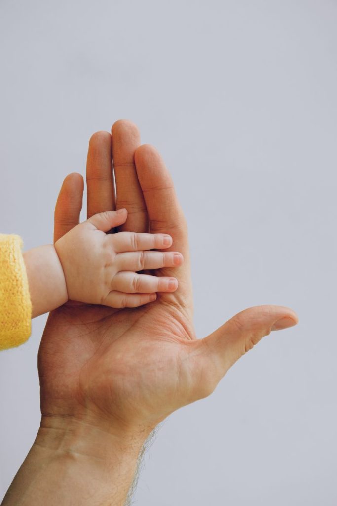 baby and parent hand